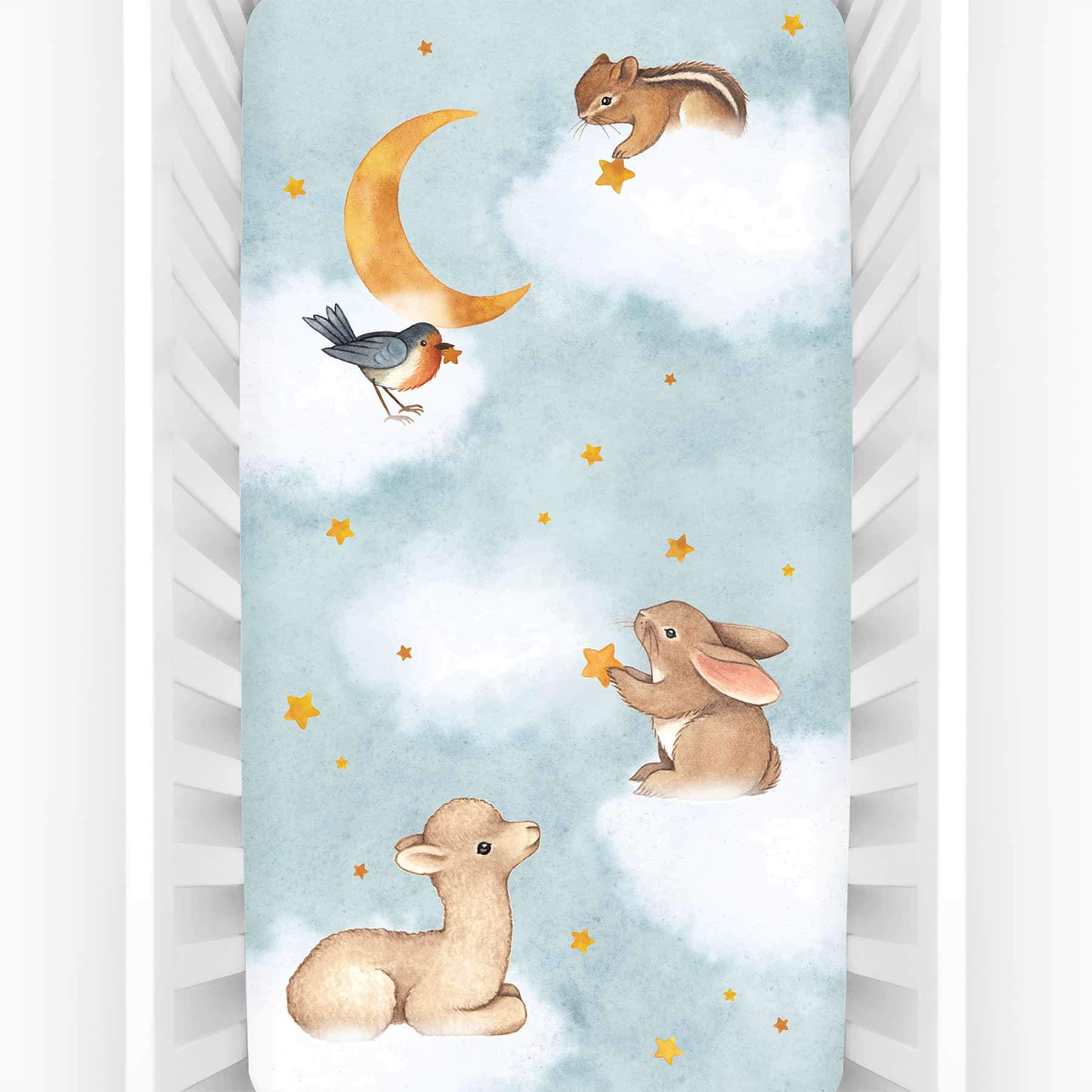 Rookie Humans crib sheet Goodnight Wonderland, fitted crib sheet with llama bunny bird moon stars and chipmunk. Light blue crib sheet with clouds.