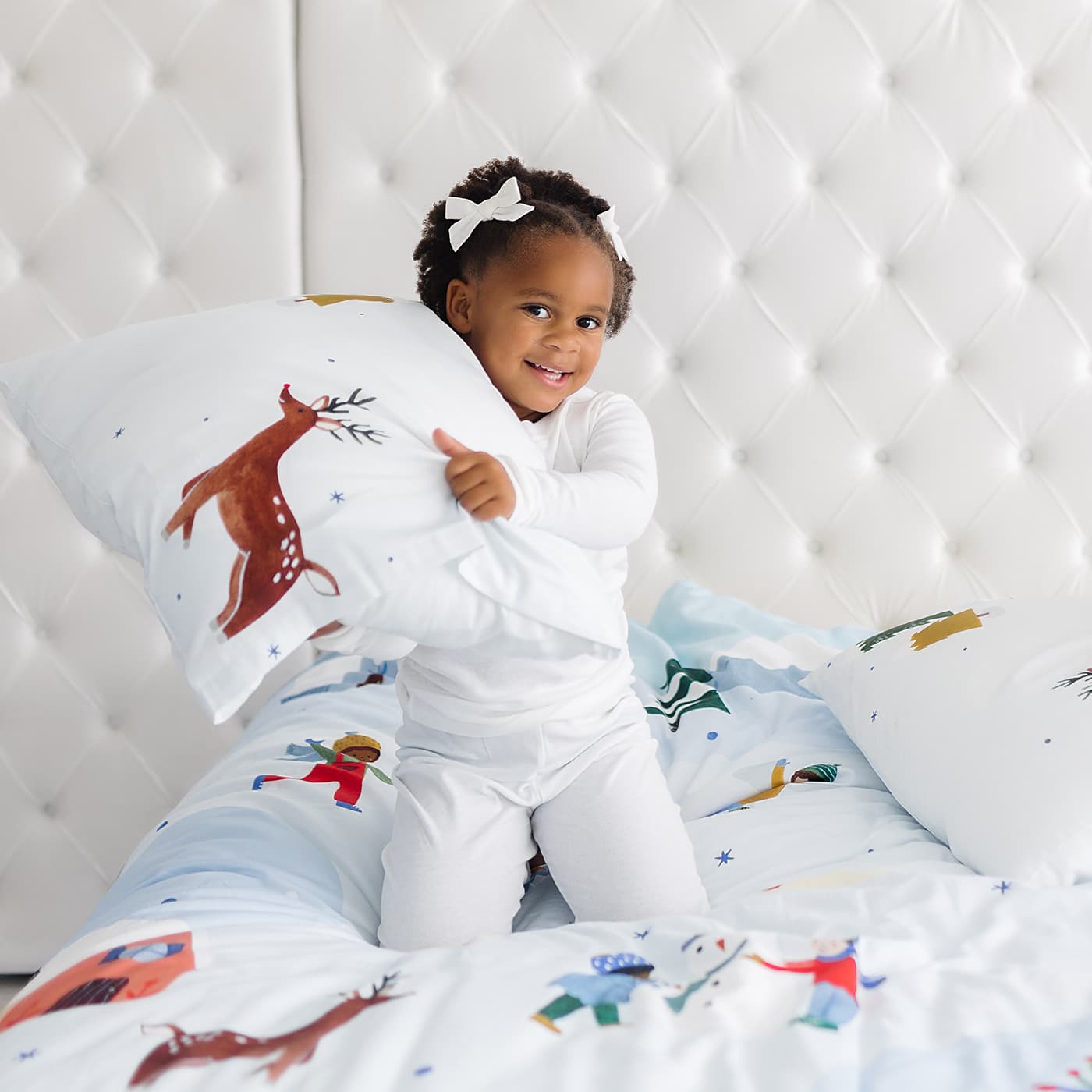 Snowy day holiday christmas winter themed bedding in twin full and queen size. Features snowy mountains, reindeer, arctic bunnies, snowmen and polar bear. Christmas bedding set, Christmas duvet.
