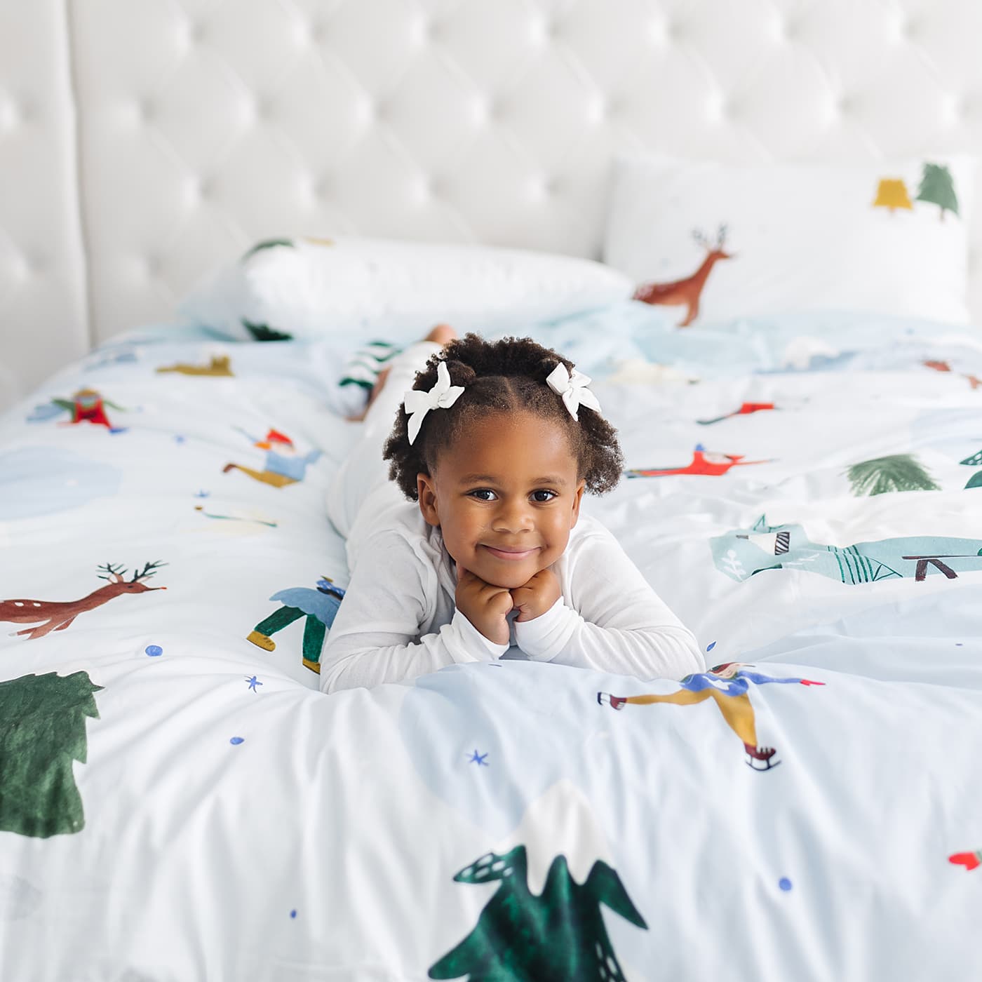 Snowy day holiday christmas winter themed bedding in twin full and queen size. Features snowy mountains, reindeer, arctic bunnies, snowmen and polar bear. Christmas bedding set, Christmas duvet.