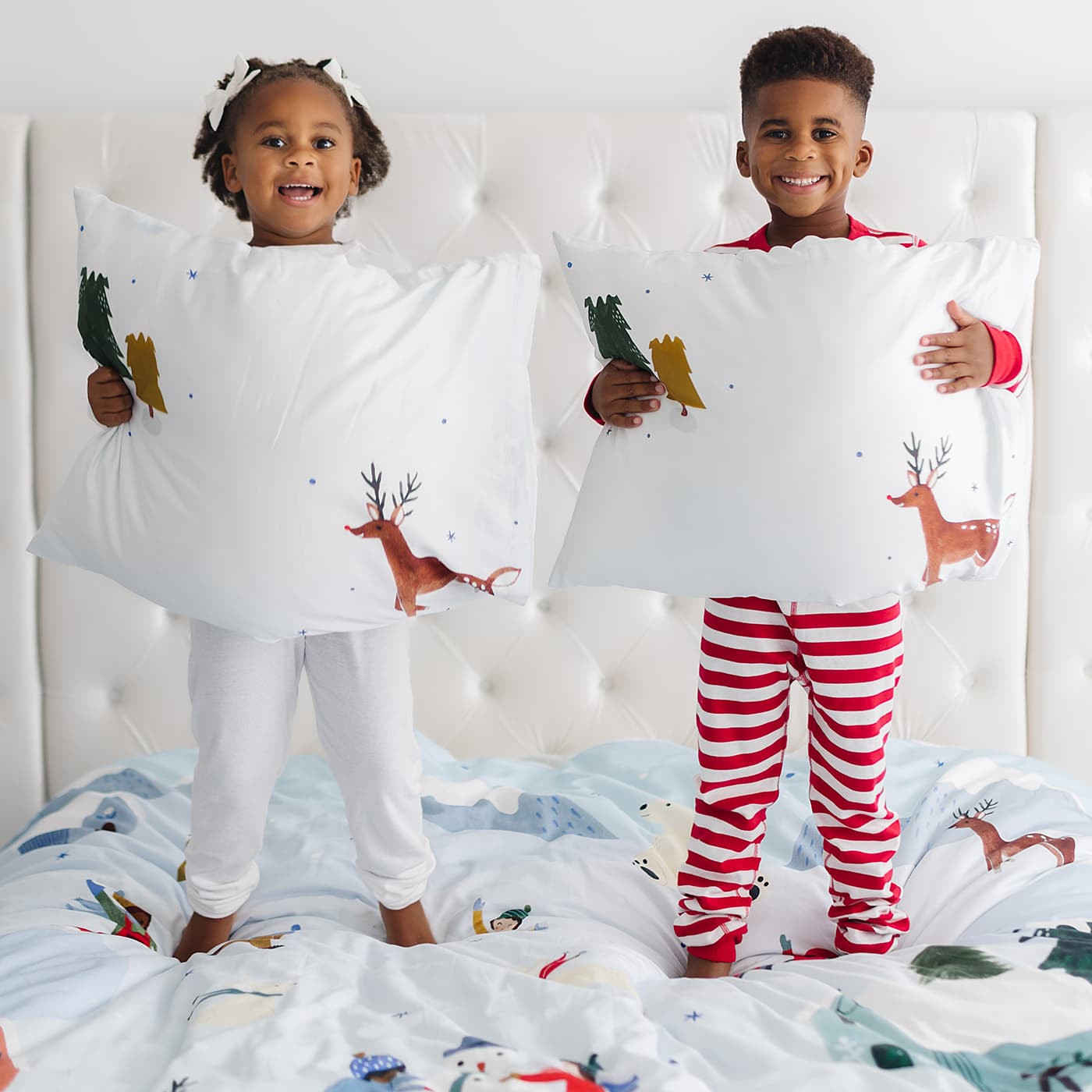 Snowy day holiday christmas winter themed bedding in twin full and queen size. Features snowy mountains, reindeer, arctic bunnies, snowmen and polar bear. Christmas bedding set, Christmas duvet.
