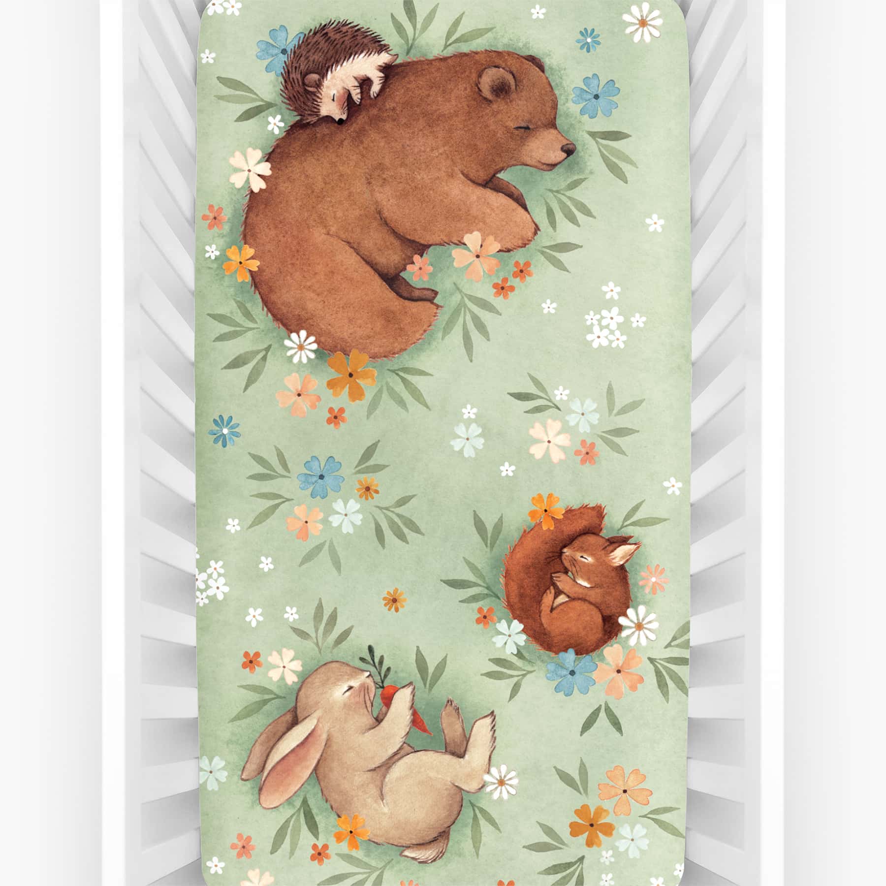 Rookie Humans crib sheet Enchanted Meadow. Floral crib sheet with sleeping bear, squirrel, hedgehog and bunny. Light green crib sheet, woodland theme, floral theme.