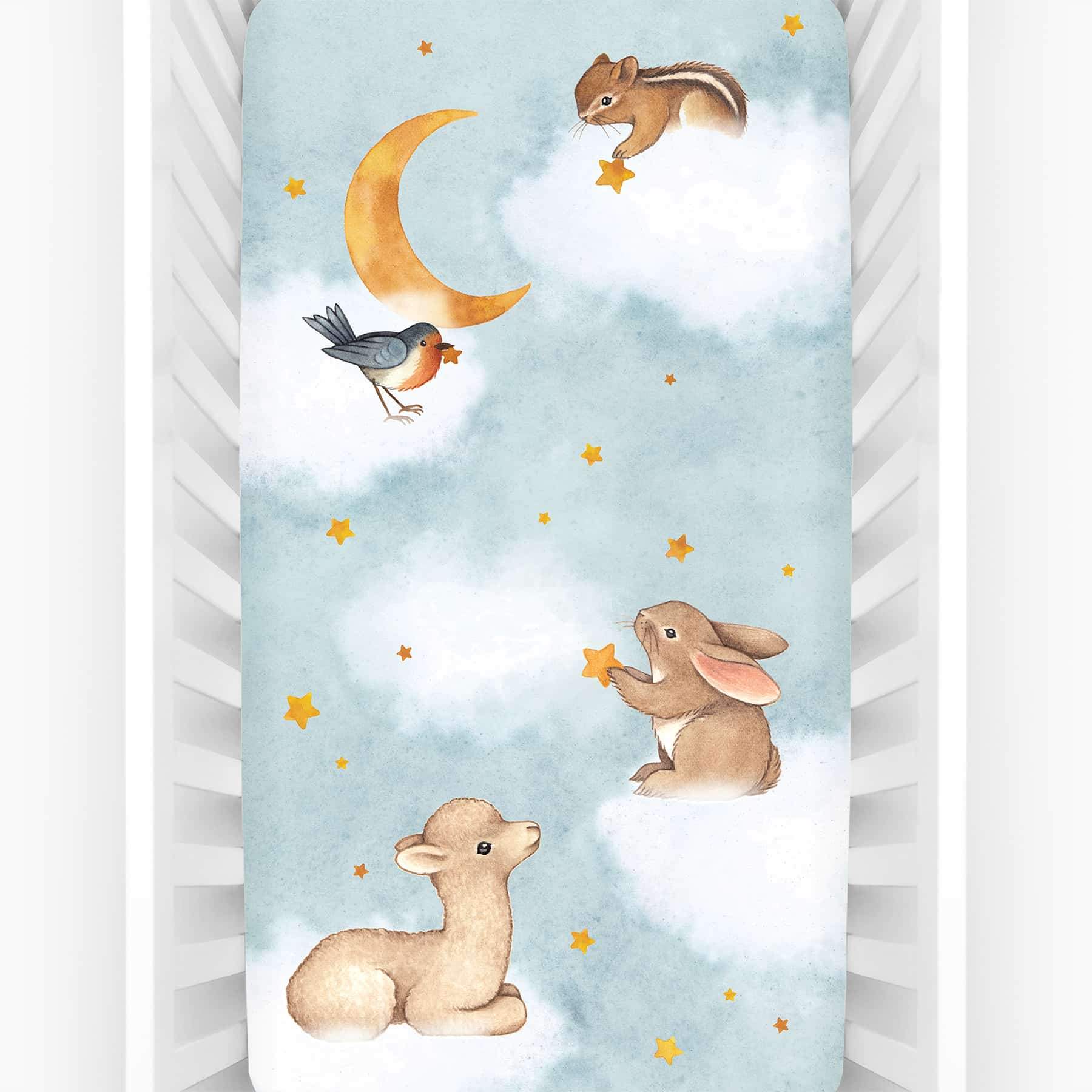 Rookie Humans crib sheet Goodnight Wonderland, fitted crib sheet with llama bunny bird moon stars and chipmunk. Light blue crib sheet with clouds. 