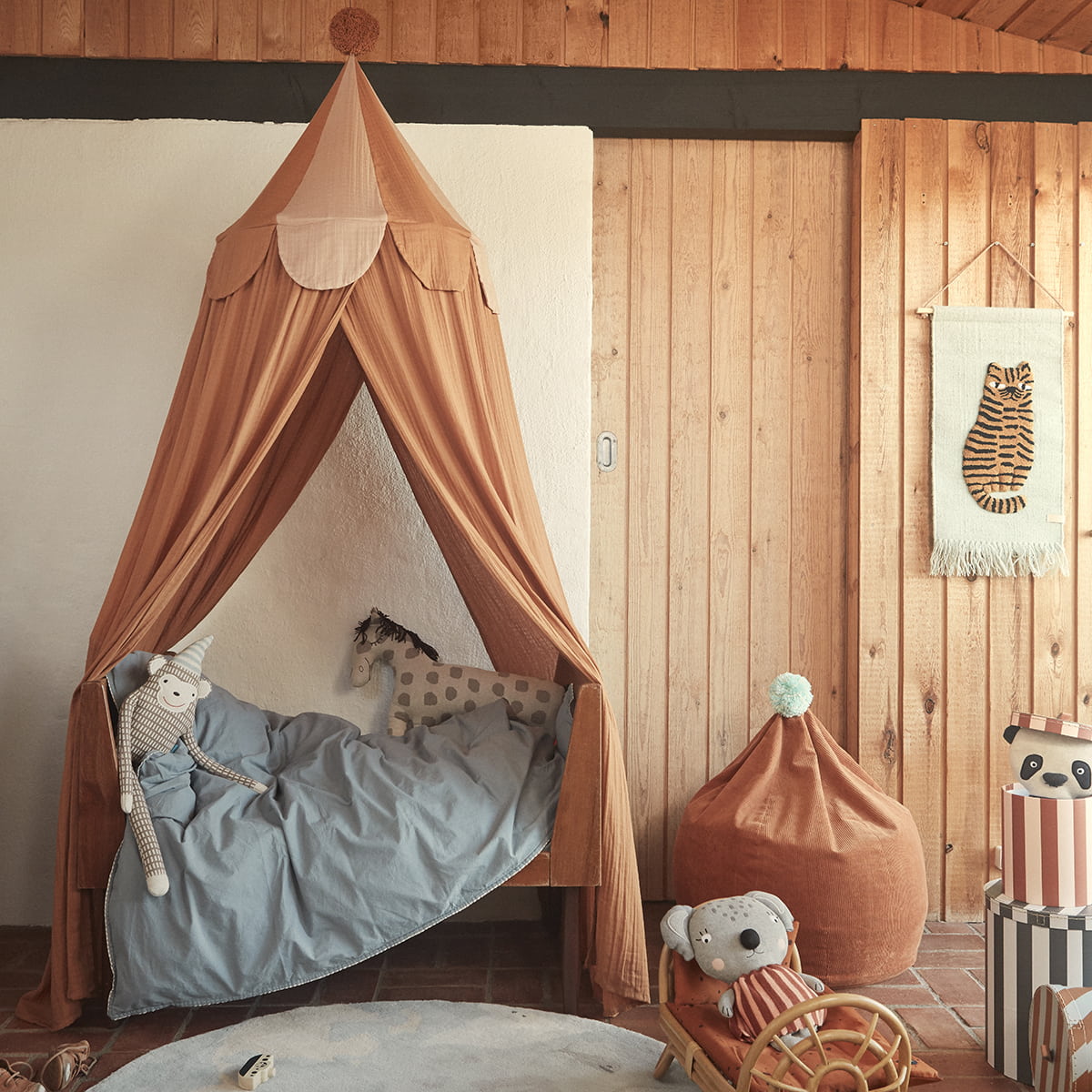 Kids cotton bed canopy in rust with pompom