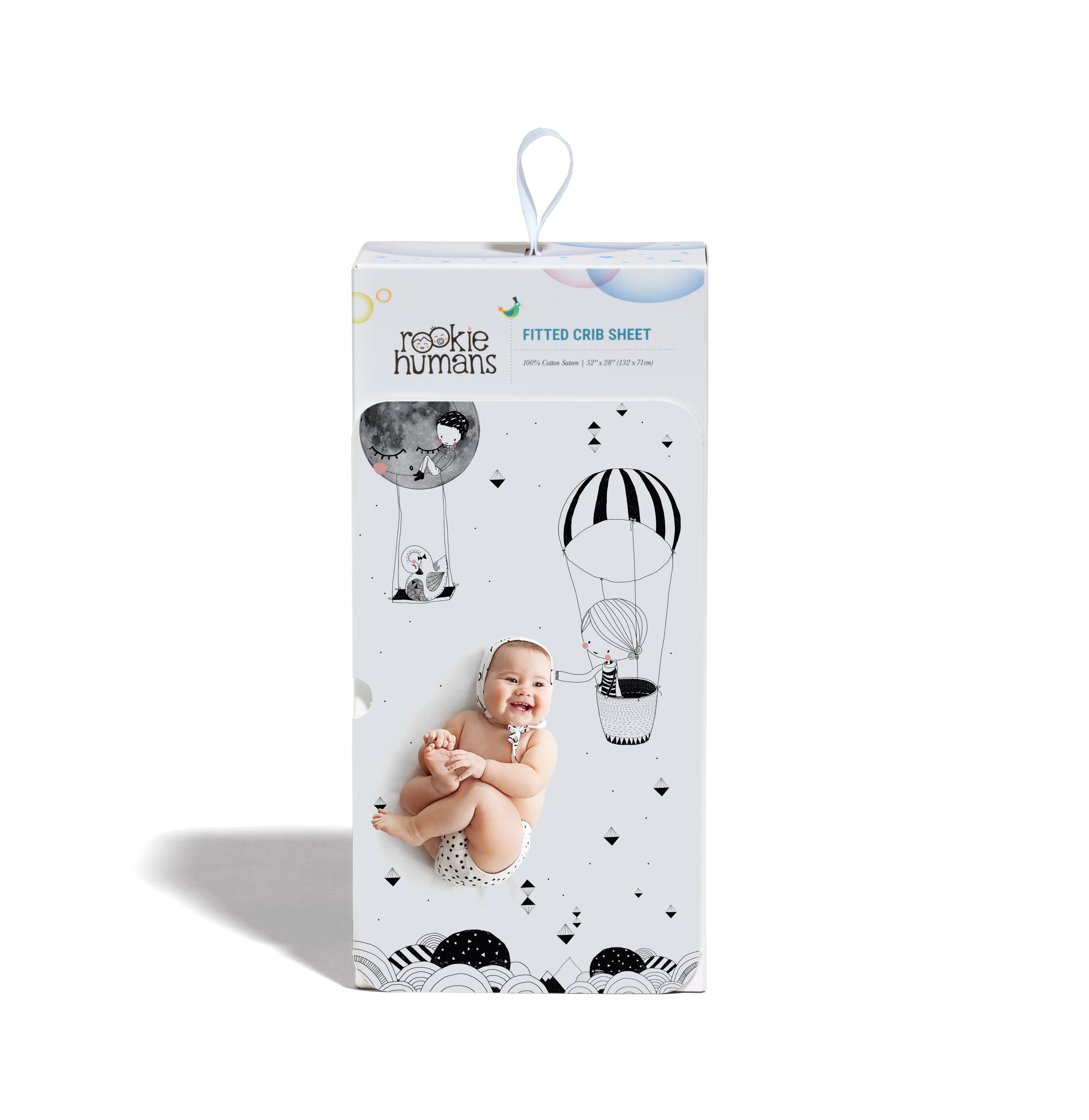 Fitted baby crib sheet by Rookie Humans, Frieda and the hot air balloon. Illustrated by Swanjte Hinrichsen. Designed for the modern nursery, packaged to make a unique baby shower gift. Monochrome nursery.