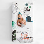 Fitted baby crib sheet by Rookie Humans, Underwater Love. Illustrated by Swanjte Hinrichsen. Designed for the modern nursery, packaged to make a unique baby shower gift. Nautical and ocean theme.