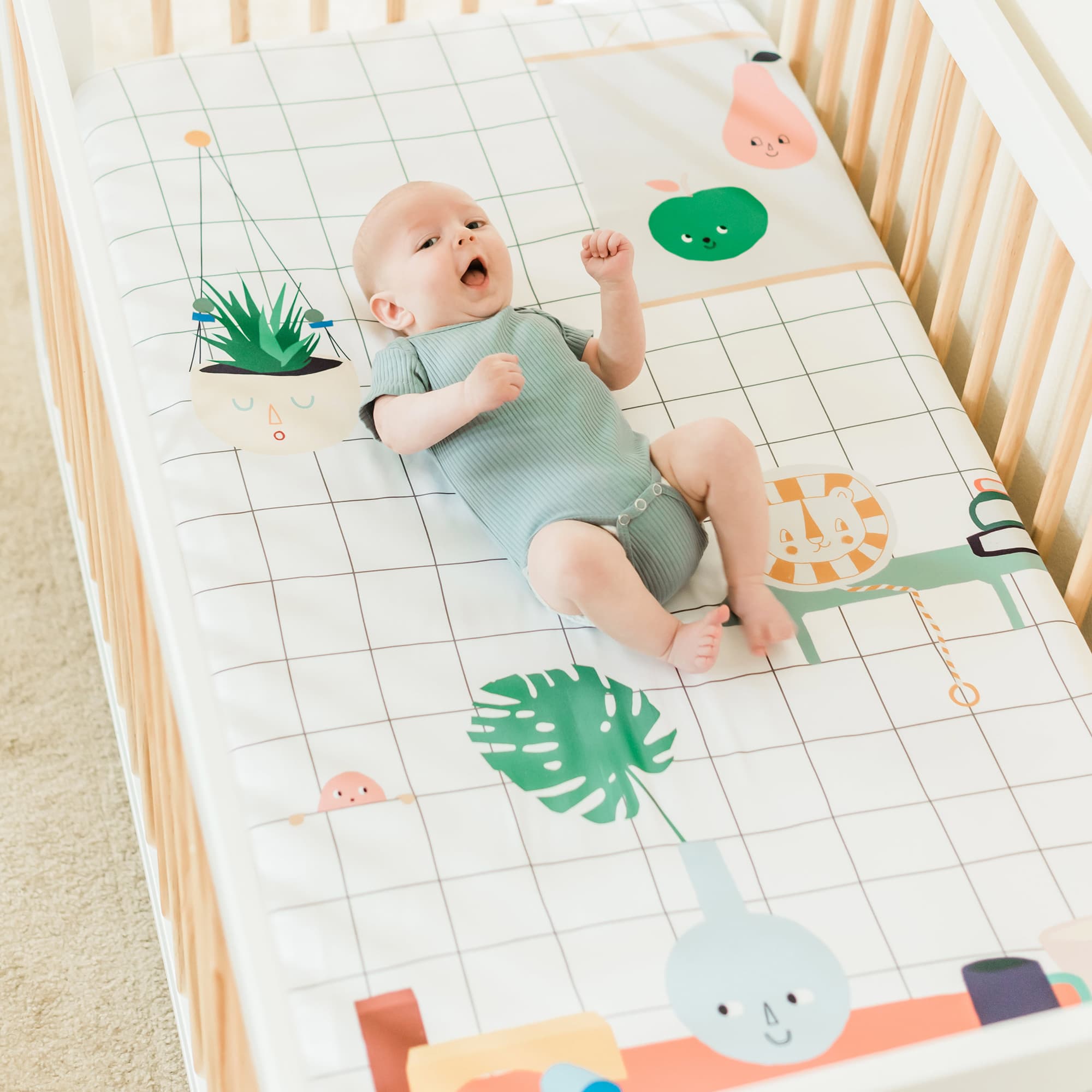 Baby's Room crib sheet by Rookie Humans. Modern crib sheet design has a hanging planter, painting, and toys.