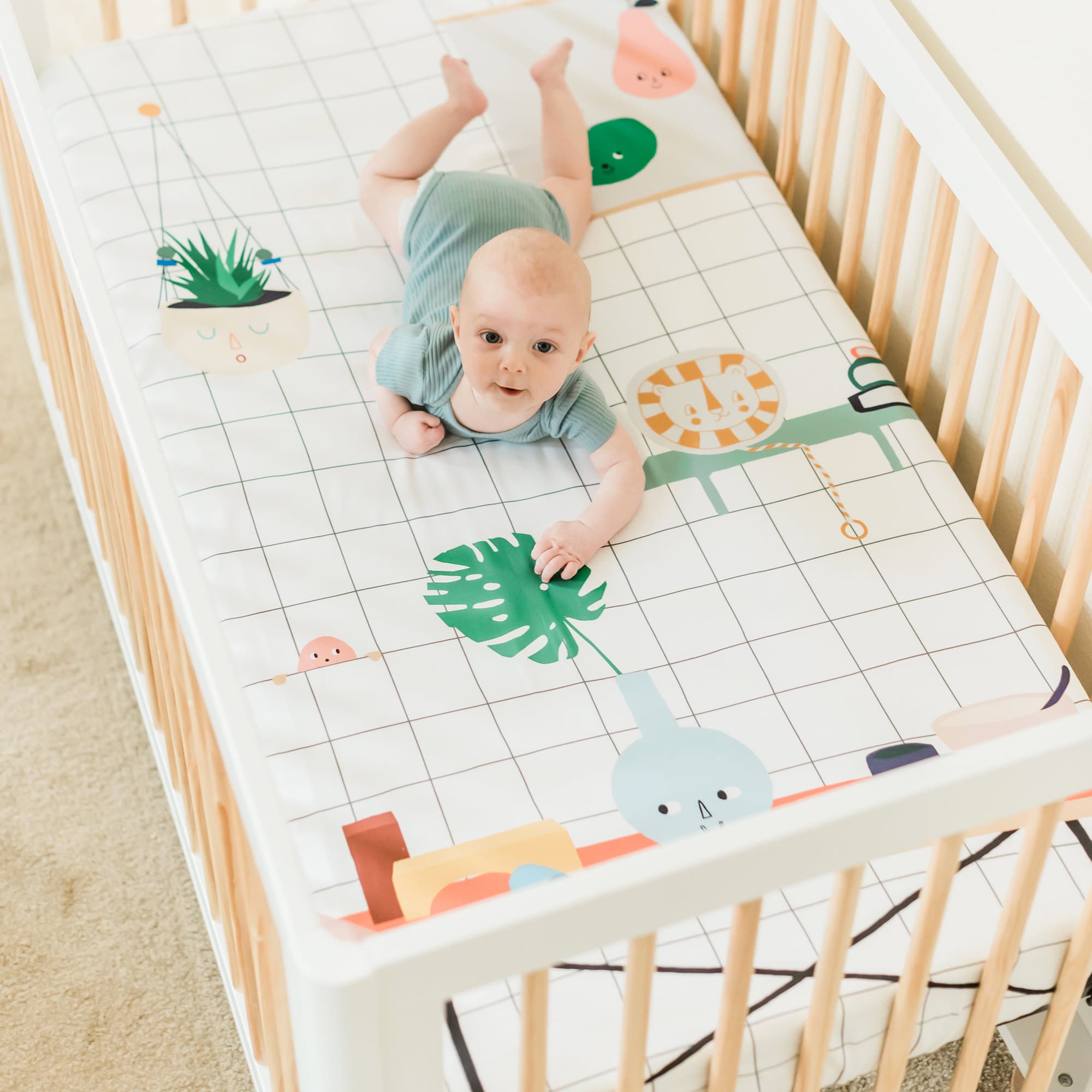 Baby's Room crib sheet by Rookie Humans. Modern crib sheet design has a hanging planter, painting, and toys.