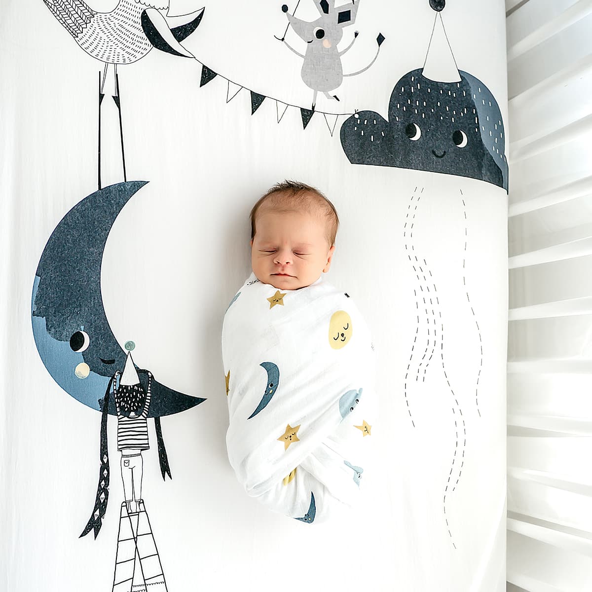 crib sheet and matching swaddle bundle with moon, cloud, bird, stars, mouse. 