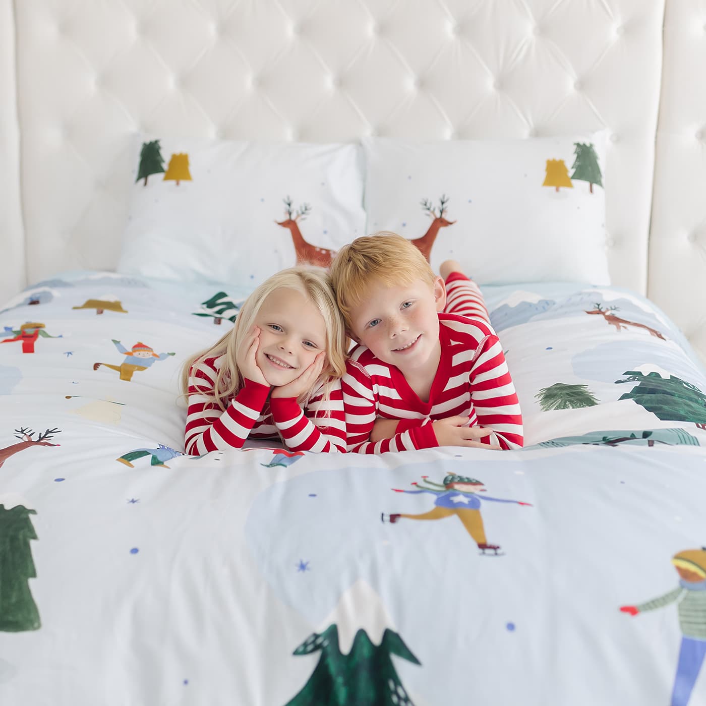 Snowy day holiday christmas winter themed bedding in twin full and queen size. Features snowy mountains, reindeer, arctic bunnies, snowmen and polar bear. Christmas bedding set, Christmas duvet.